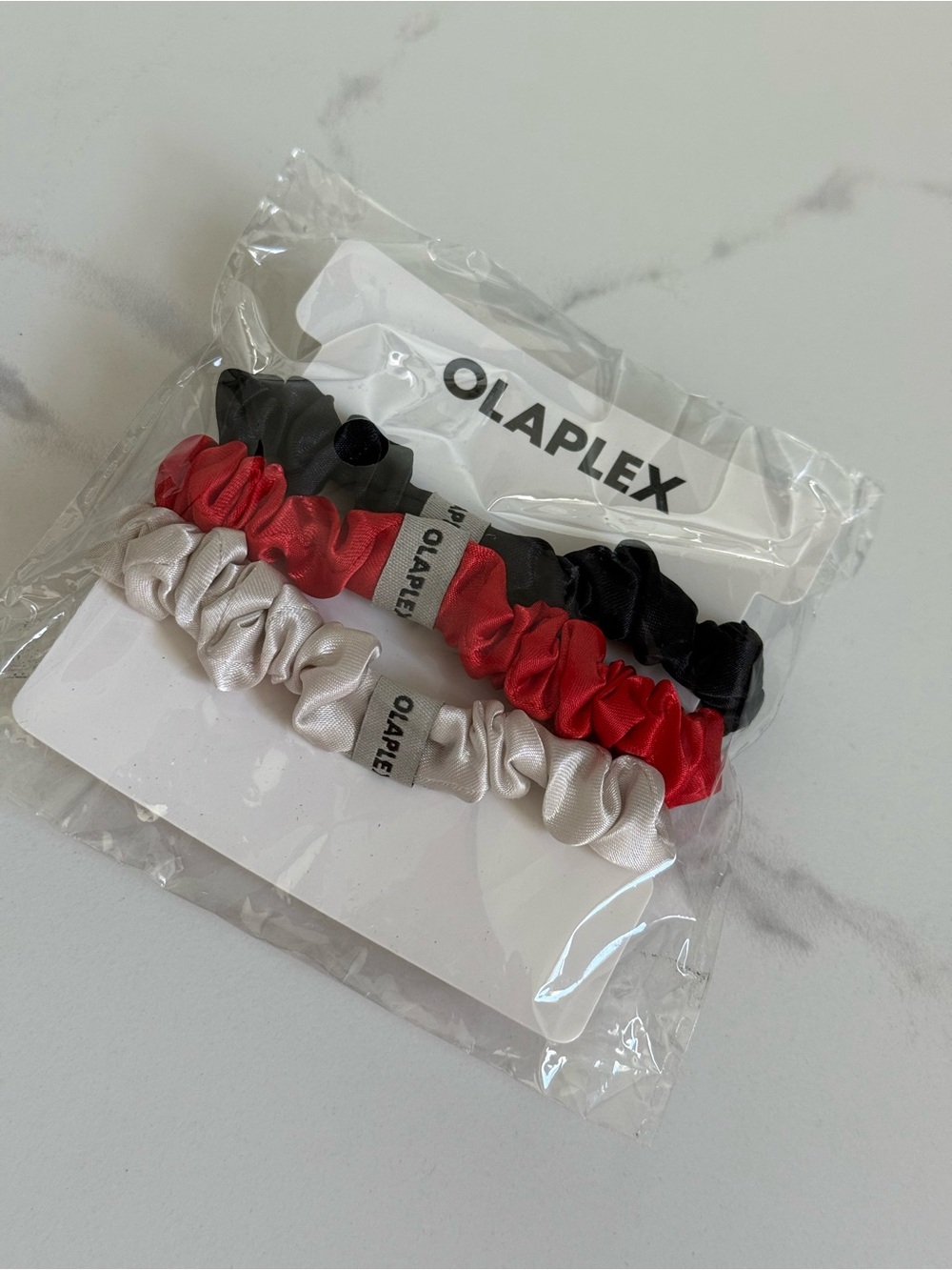 OLAPLEX Satin Hair Scrunchies Trio - Black, Red, Silver